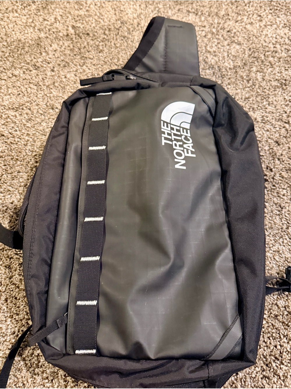 The North Face Black Sling Pack with White Logo